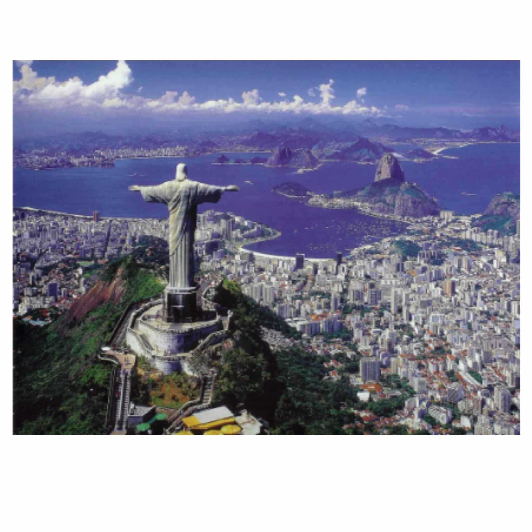 Aerial view of Christ the Redeemer statue overlooking Rio de Janeiro with Sugarloaf Mountain and Guanabara Bay in the background